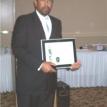 Fredrick Brabson Sr pictured with WKU HOF 2006 Master of Year Award